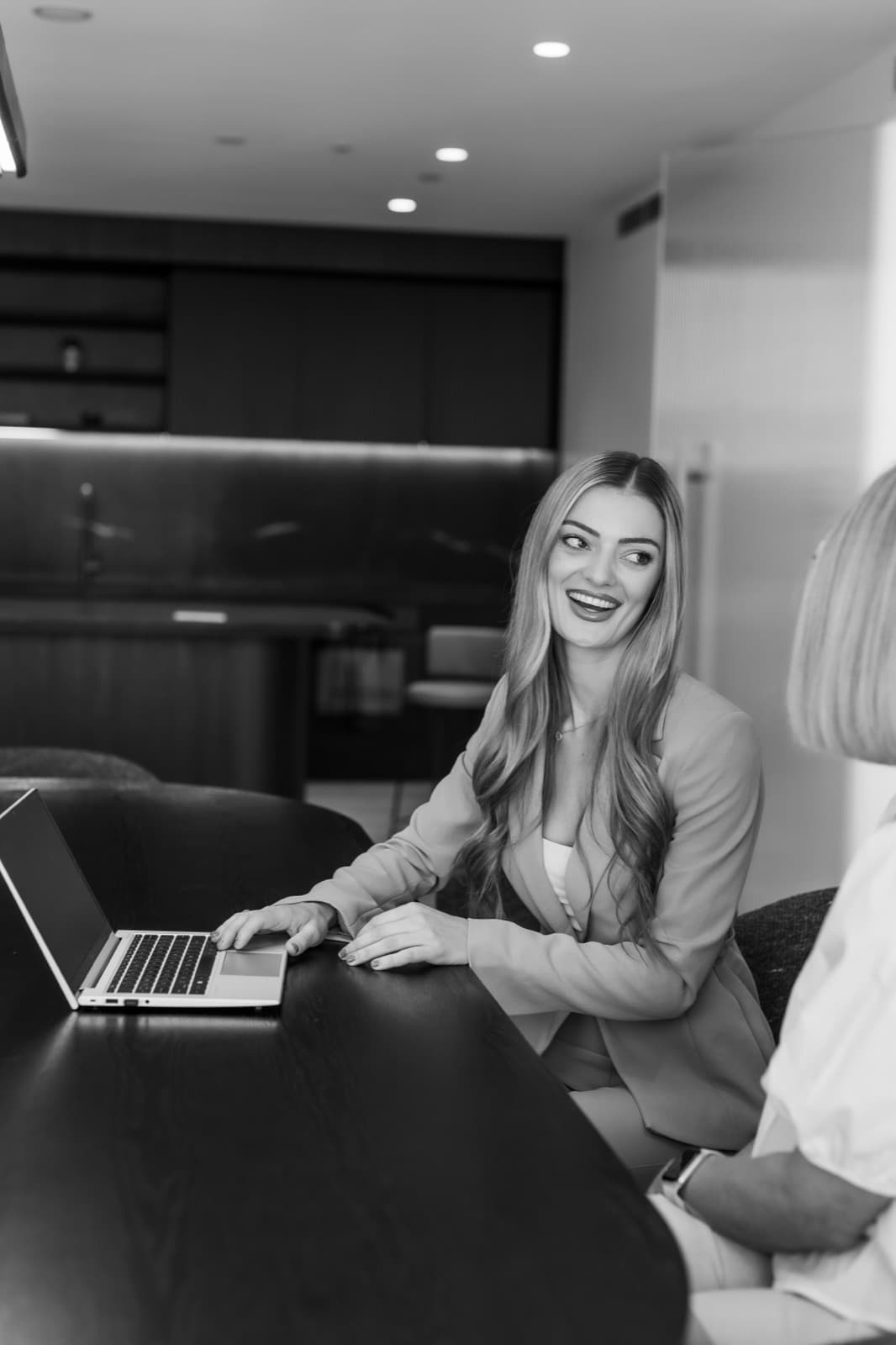 Rebecca Tickner, Australian finance broker, in client meeting